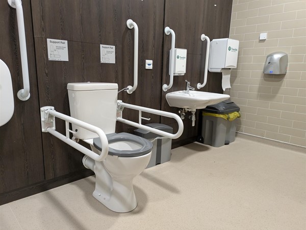 Image of toilet seat in the Changing Places toilet with grabrails