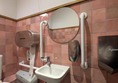 Image of sink with lever-style tap and rails on either side