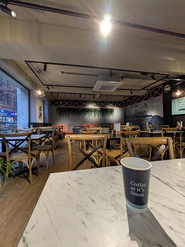 image of seating area and coffee cup