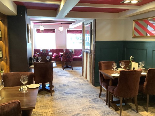 If someone managed to lift your wheelchair or scooter up over the two steps on the ramp, then they will find a nice spot for you to enjoy a delightful lunch with them