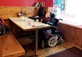 Image showing Claire sitting at the table at The Harbour Cafe.