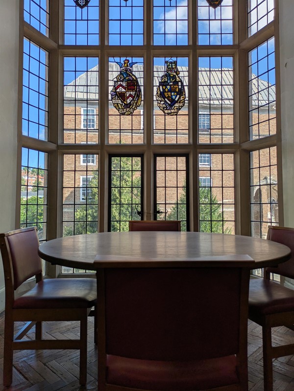 Image of conference table in front of a bay window
