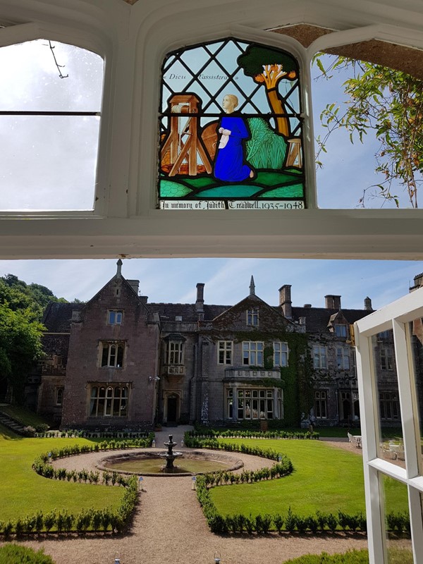 A picture out of the wedding room showing the stained glass windows.