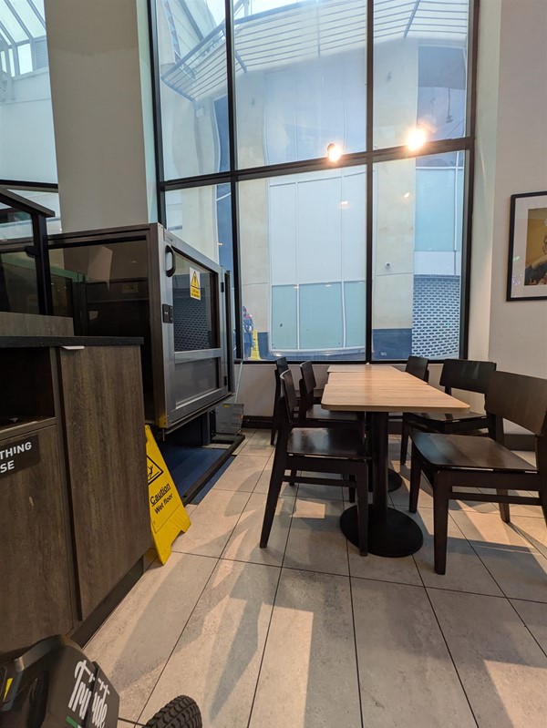 Image of tables placed at the accessible lift