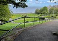 The view from the upper section of the park looking down to the lawns of the lower section and the seafront in the distance