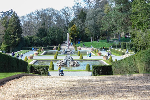 Water gardens with pebble and gravel surfaces, hill and steps.