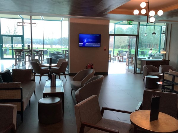 Another view of the dining room with tables and chairs
