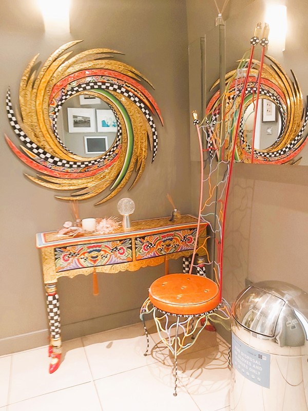Image of a mirror and chair in a room