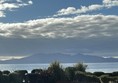 Image of the sky with some trees at the bottom