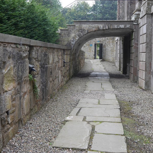 Picture of pathway under an arch