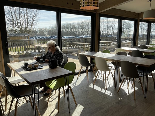 Image of a person sitting at a table.