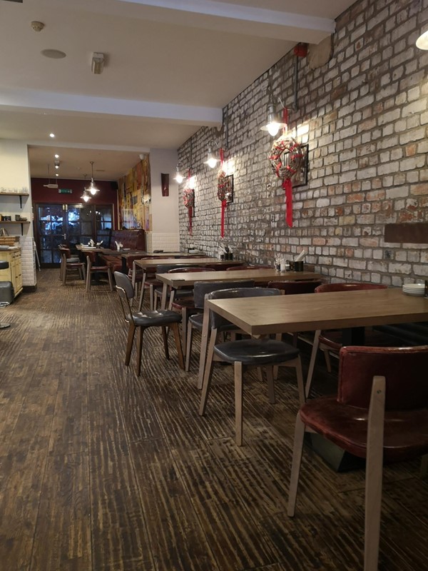 Low tables at the back of the restaurant.