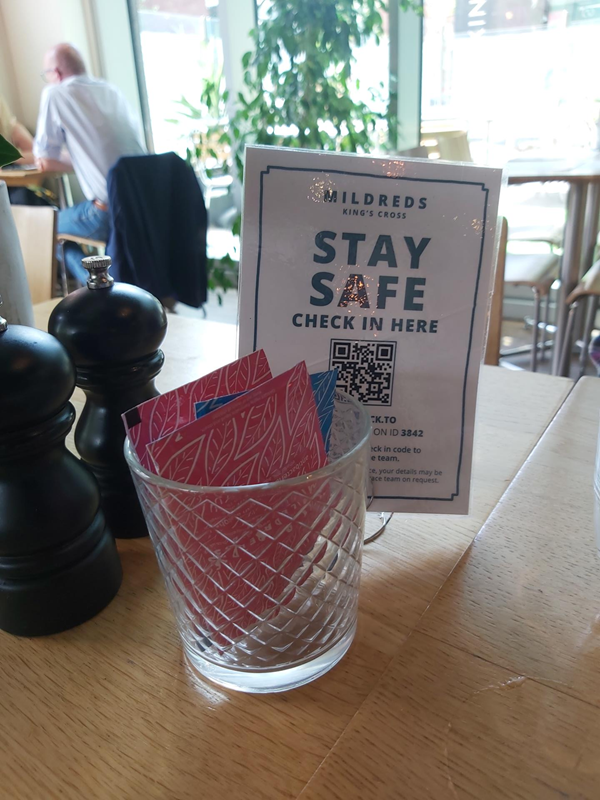 QR code check in and hand wipes on each of the tables