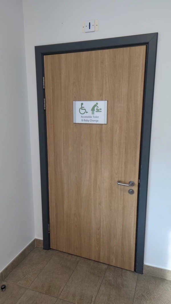 Image of door to accessible toilet.