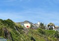 View of cottage from bottom of cliff. My friend waving a red slide sheet!!