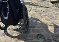 Image of a wheelchair on a causeway