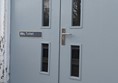 Image of large grey double doors