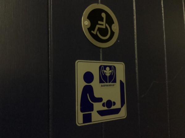 Image of an accessible toilet and baby changing sign
