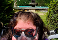Image of a person in front of a house
