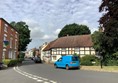 Street with a van and a house