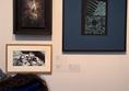 Image of a person looking at paintings