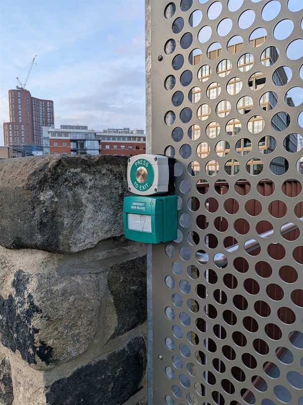 image of gate and release button at north end