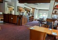 Seats and tables inside the pub
