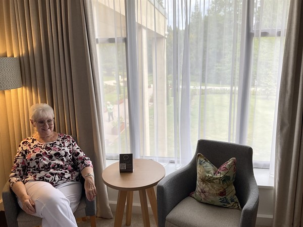 Two comfortable side chairs allow comfort for sitting to watch TV, or gaze out across the landscaped gardens.