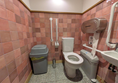 Image of accessible toilet - there is a bin in the transfer space