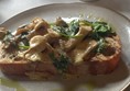 Wild mushrooms in garlic butter in the café for lunch.