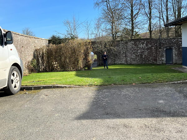 The building is situated within the old walled garden of the nearby big house