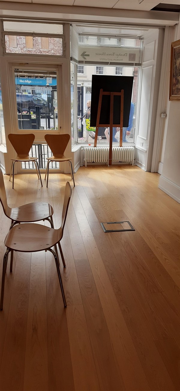Image of chairs in a room with windows