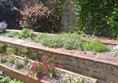 A row of flower beds sitting on different level platforms