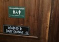 Accessible toilet door showing yale lock