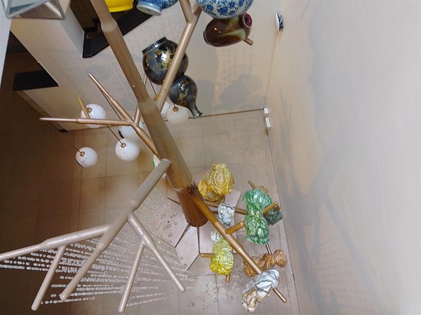Image of an artwork involving tied up crockery