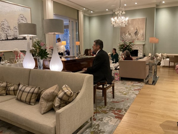 Image of a person playing a piano