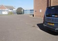 Spacious car park with disabled places close to the entrance.