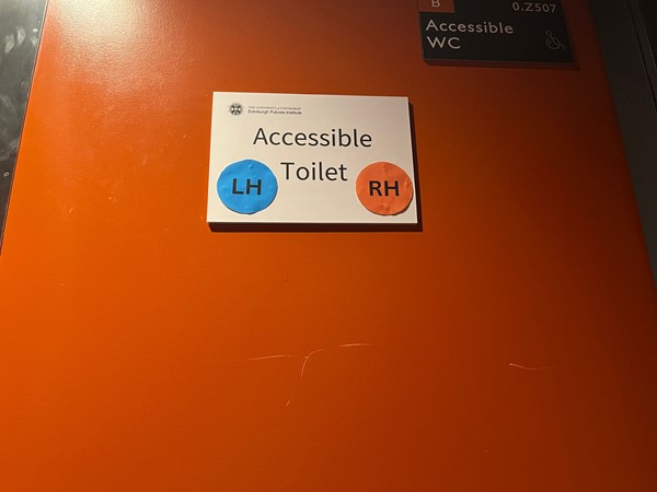 Image showing the sign on the accessible toilet showing that is a right-hand and left-hand transfer.