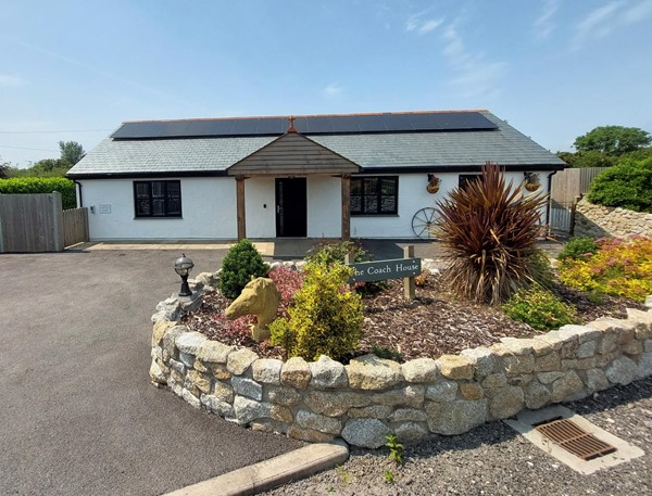 Outside view of the cottage. Plenty of parking and level access into the property