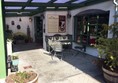 Outdoor patio and entrance to Chocolate Lounge.