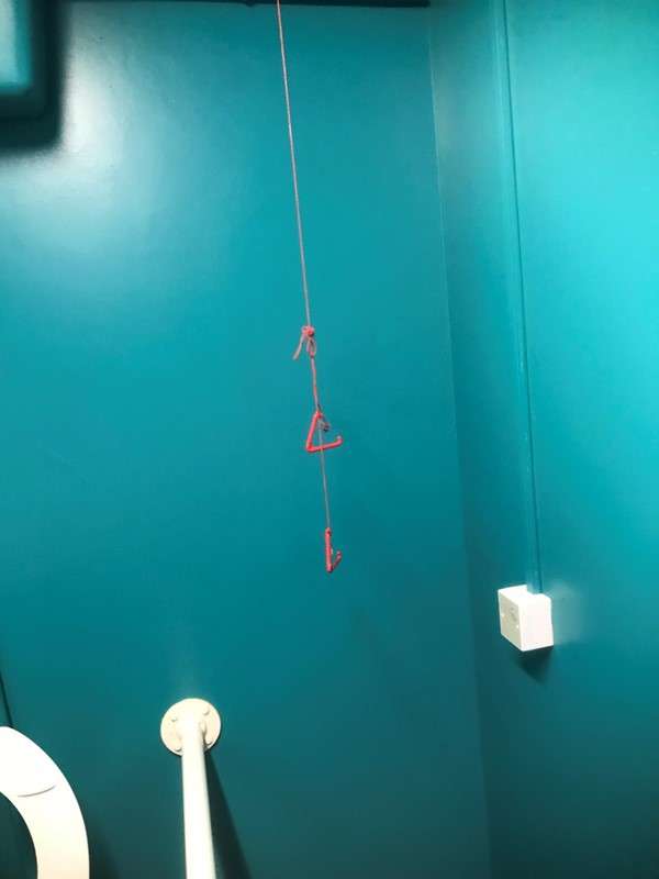 The red pull cord tied up.
