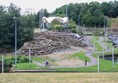 View of white water park with paths going around it.