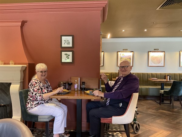 Image of two people at a table