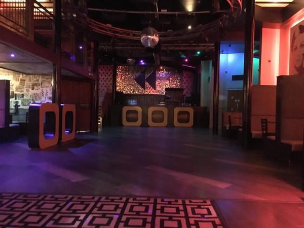 Image of the dancefloor within Rewind and has booths situated at the sides of the dancefloor.