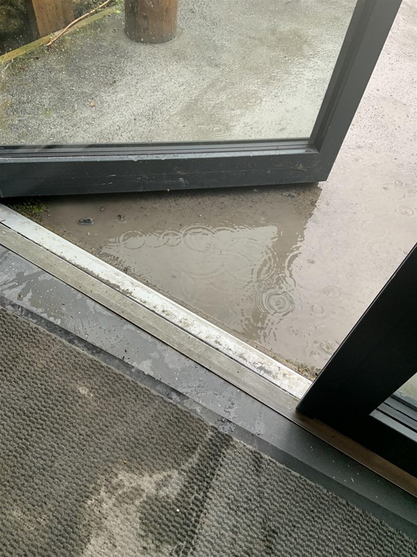 Image of a door lip and rain