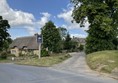 Image of a path by a cottage