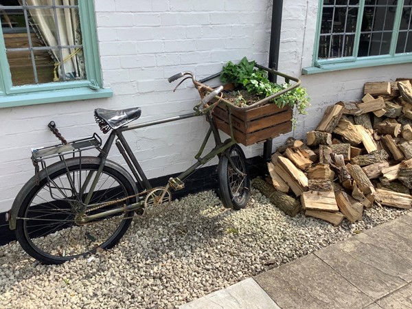 By the front door we spotted a relic of our youth, an old delivery bike