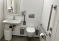 Accessible toilet near the cafe in same corridor.