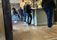 Image of people at a bar