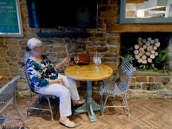 Image of a person sitting at a table